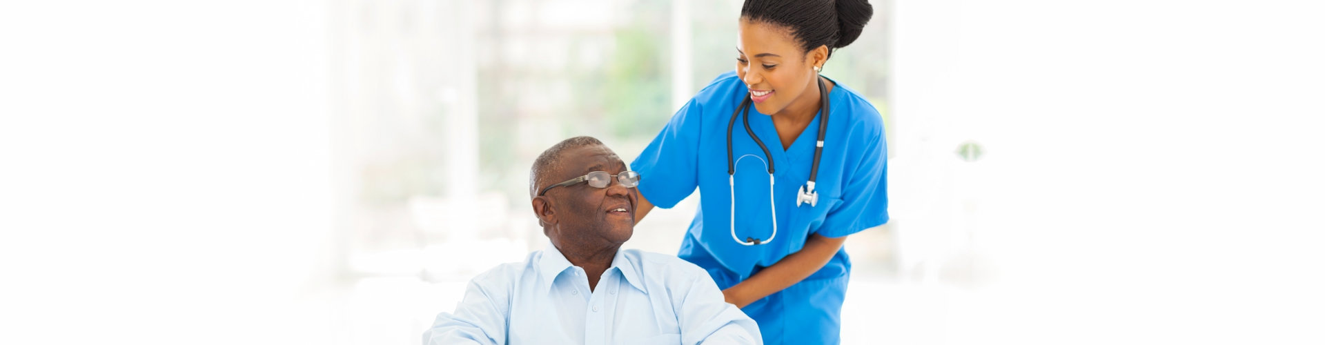 nurse smiling over patient