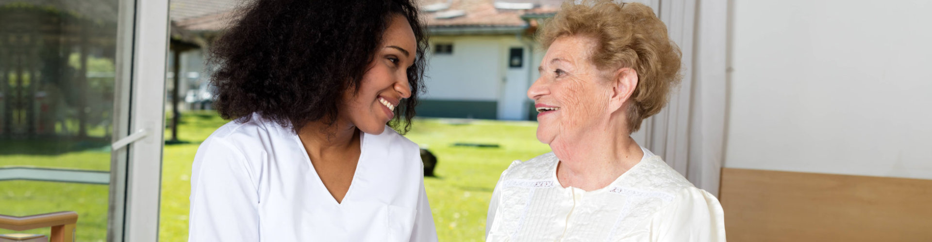 nurse accompanying elderly female patient